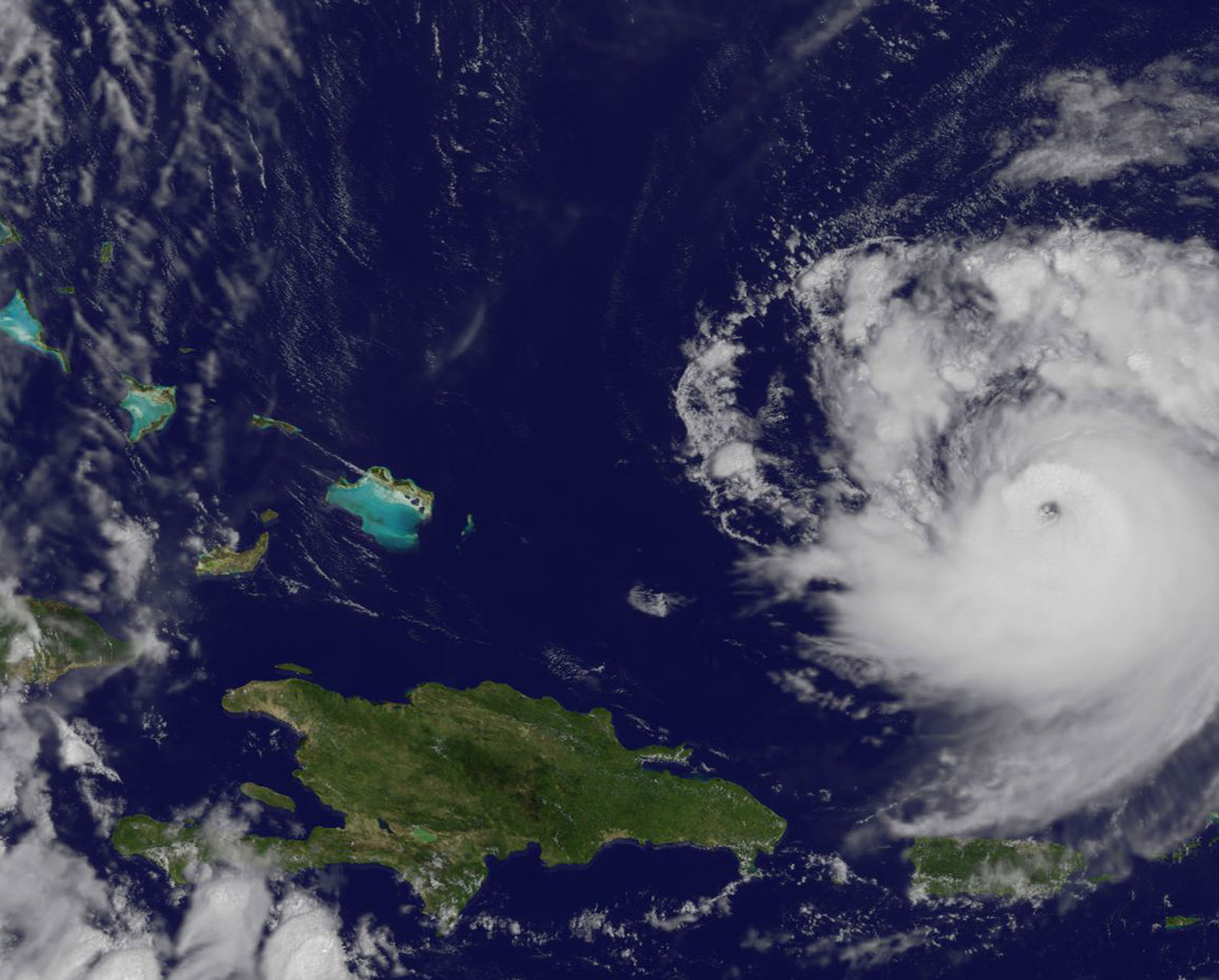 Satellite image of Jose, a swirling cloud mass approaching islands. 