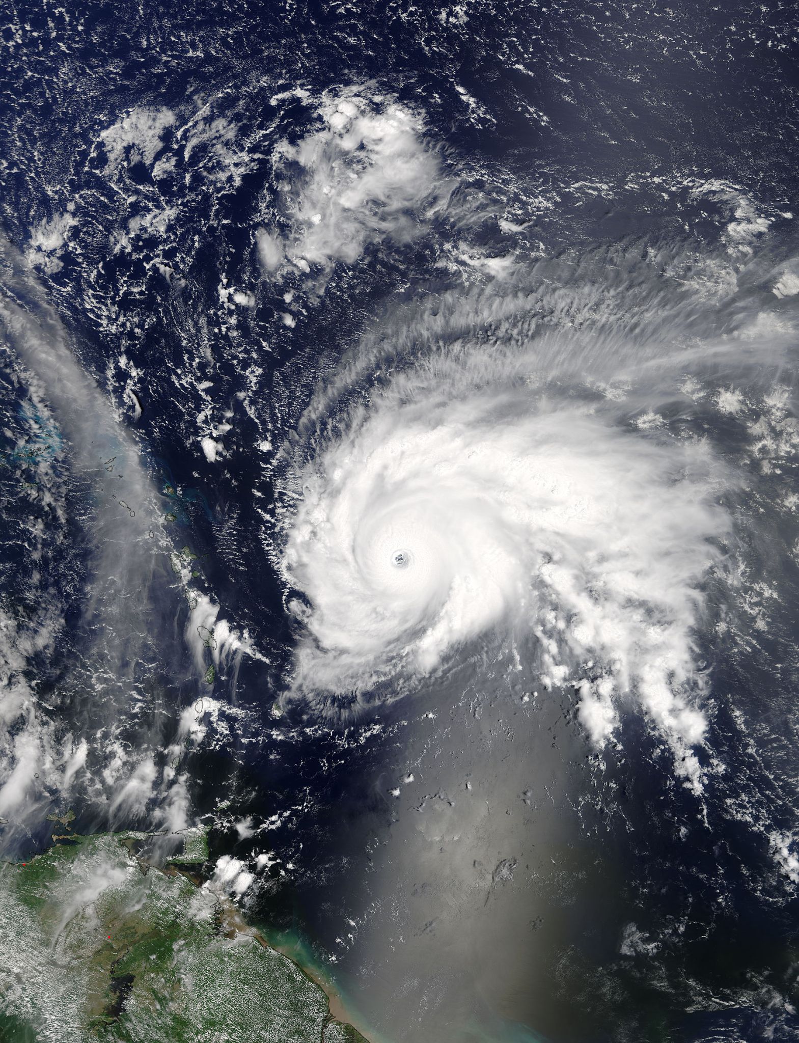 Satellite image of Jose, a swirling cloud mass with a clear eye over the ocean.