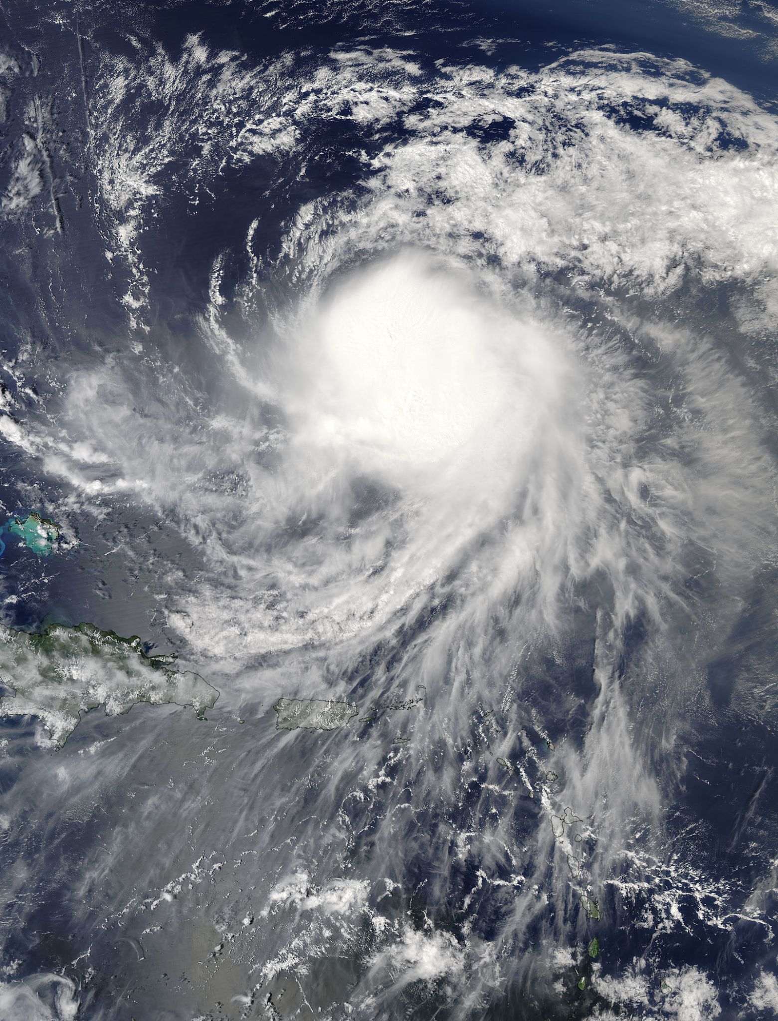 Satellite image of Jose over the Atlantic, with a mass of clouds surrounded by a loose spiral.