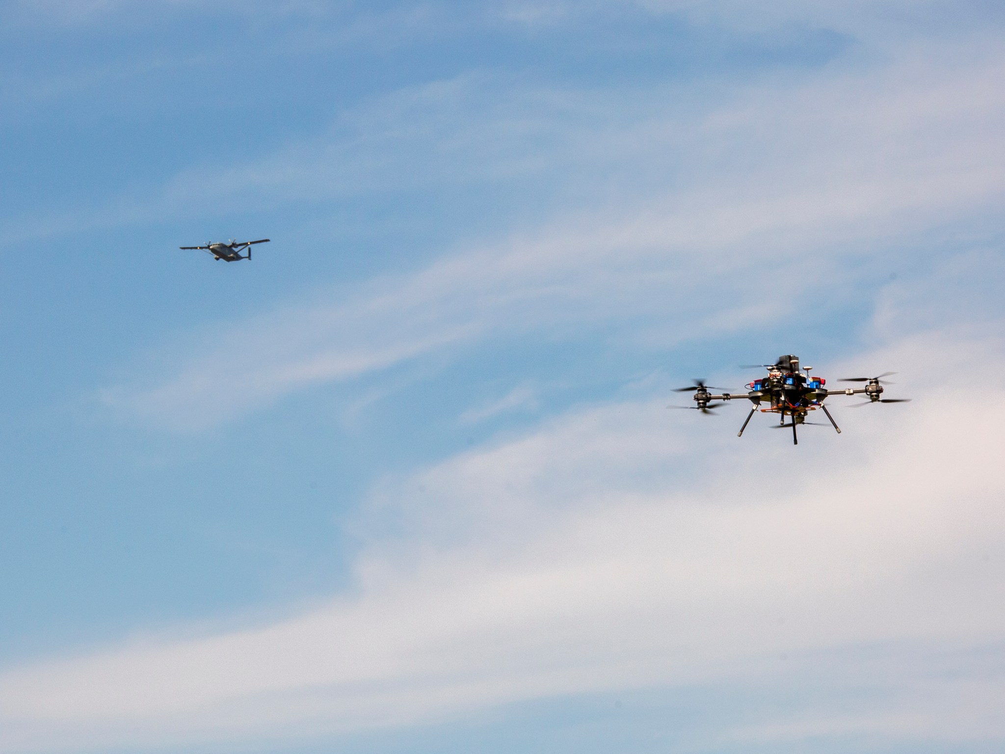 NASA’s C-23 Sherpa and a UAV collect ozone data simultaneously at different altitudes over Langley. 