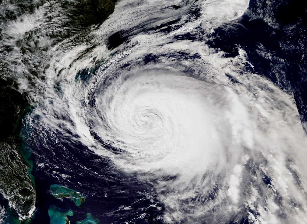 Aqua visible image of Maria with a swirling cloud mass over the Caribbean Sea.