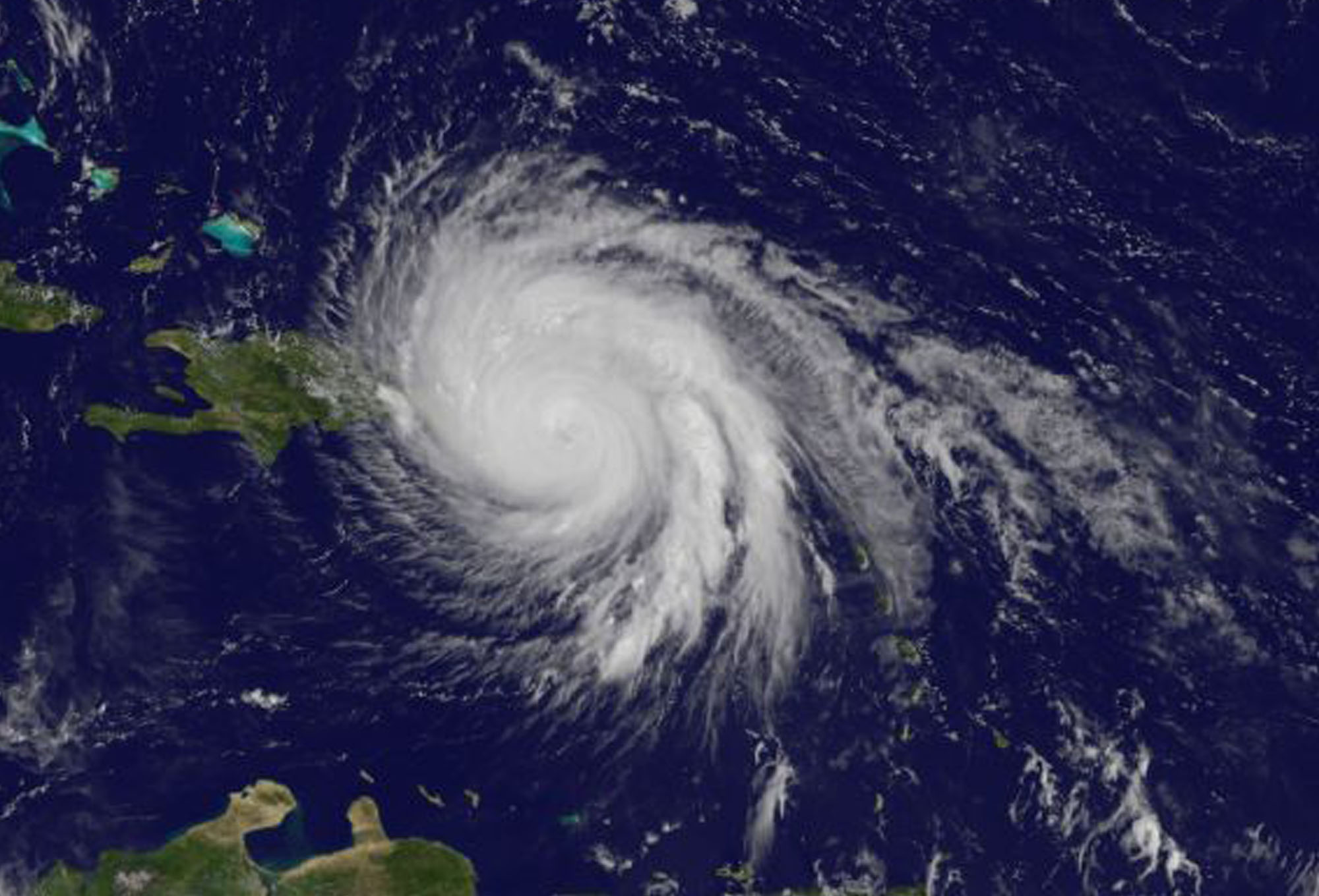 Visible light view of Maria from GOES, with a swirling mass of clouds.