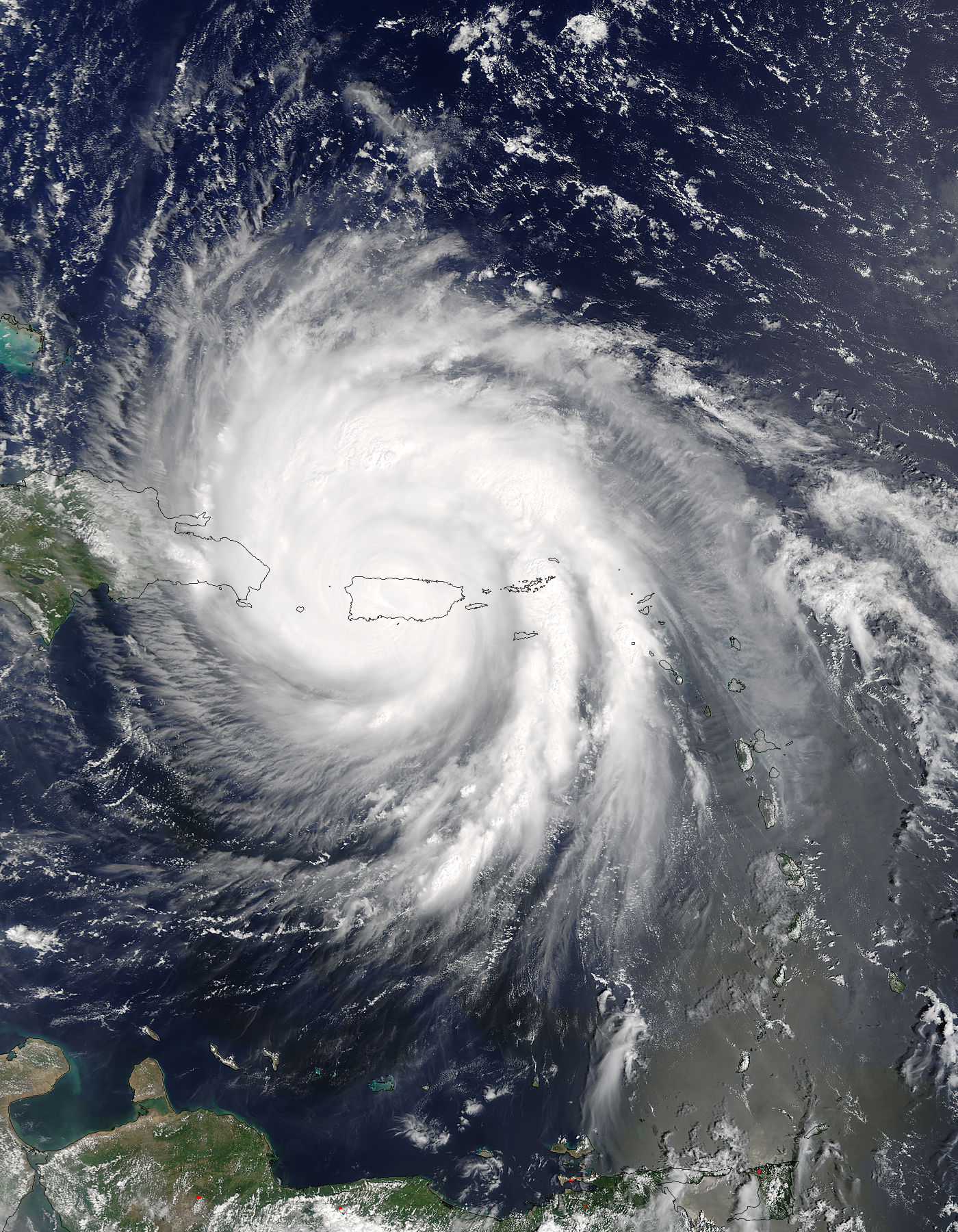 Terra image of Maria with a swirling mass of clouds over Puerto Rico.