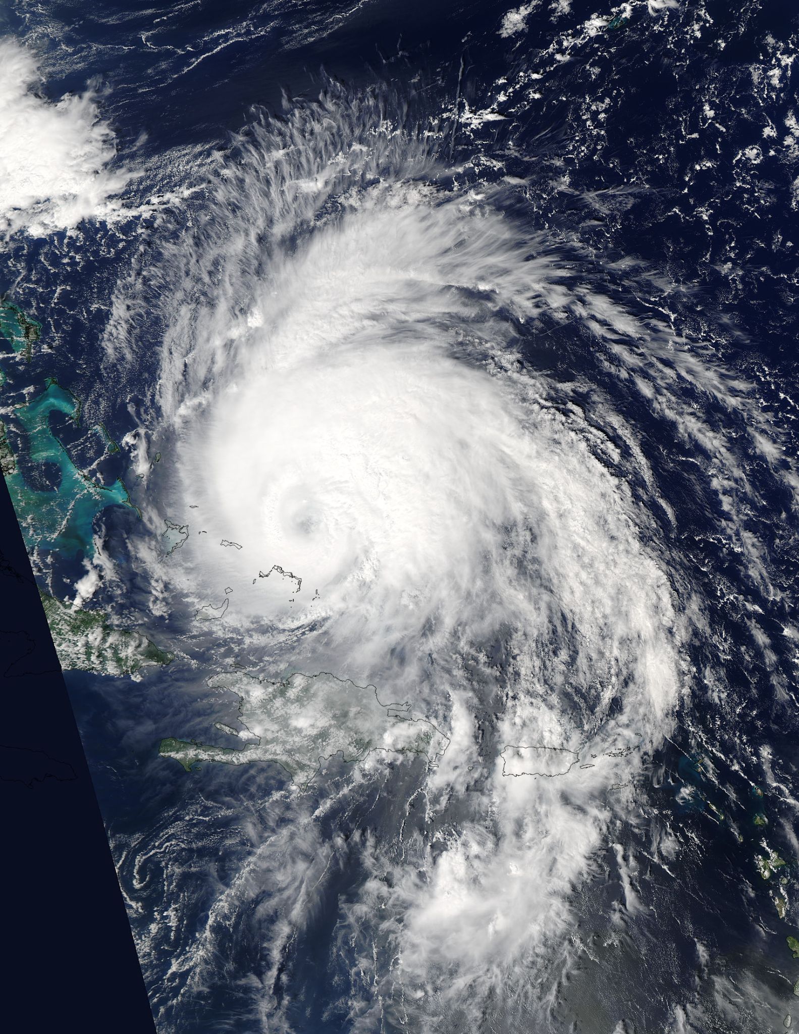 Aqua image of Maria with a swirling mass of clouds approaching several Caribbean islands.
