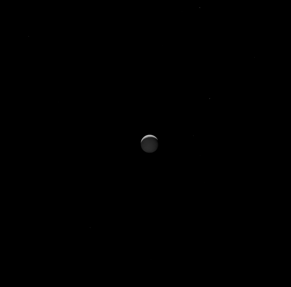 Animation of moon Enceladus behind Saturn