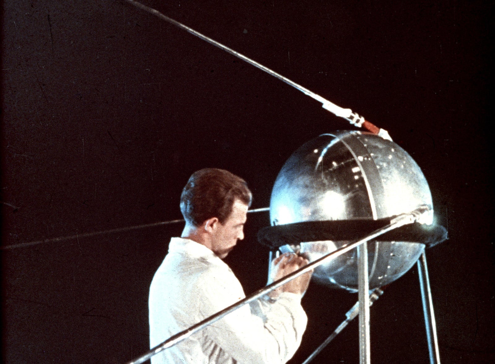 Technician making final preparations on Sputnik before launch.