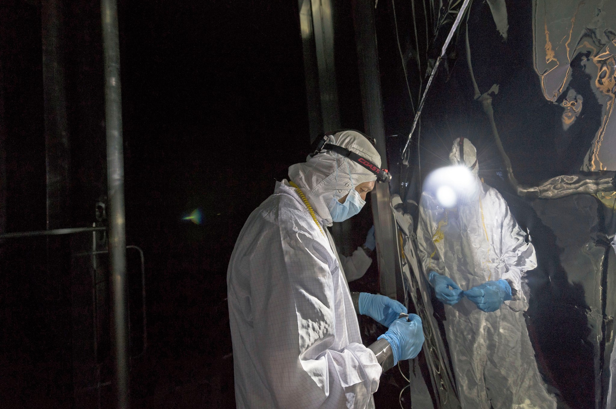 Eric Zoller, a technician from Harris Corporation, headquartered in Melbourne, Florida, checks the helium shroud in Chamber A at NASA’s Johnson Space Center.