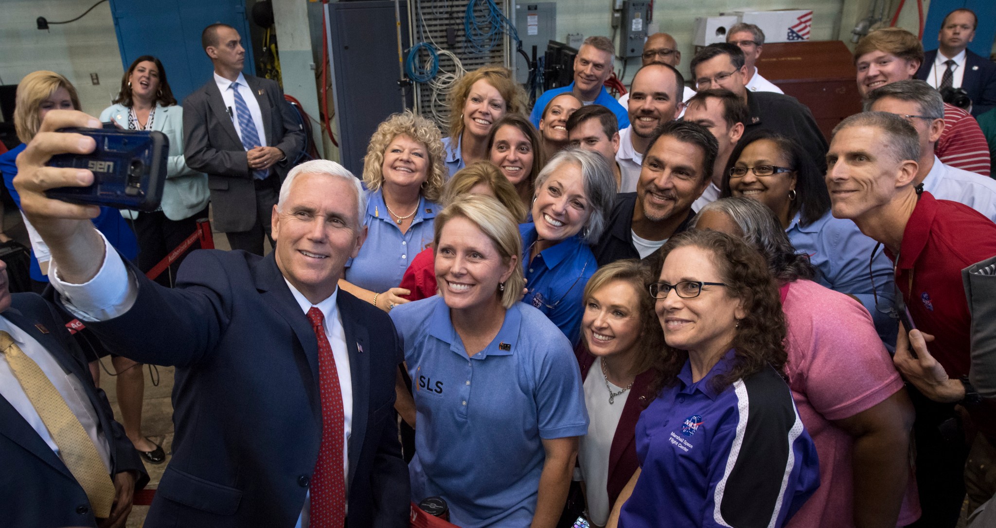 Vice President Mike Pence takes a photograph with employees after seeing the Space Launch System structural test Sept. 25.