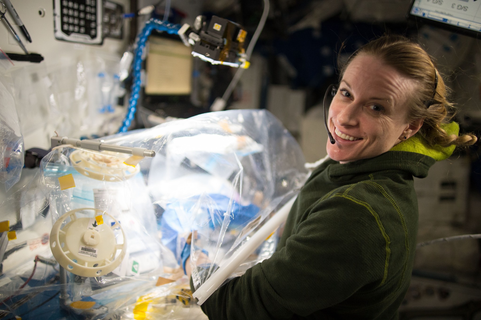 Astronaut Kate Rubins works with WetLab-2, a molecular biology system that allows gene expression analyses to be conducted entirely on board the International Space Station