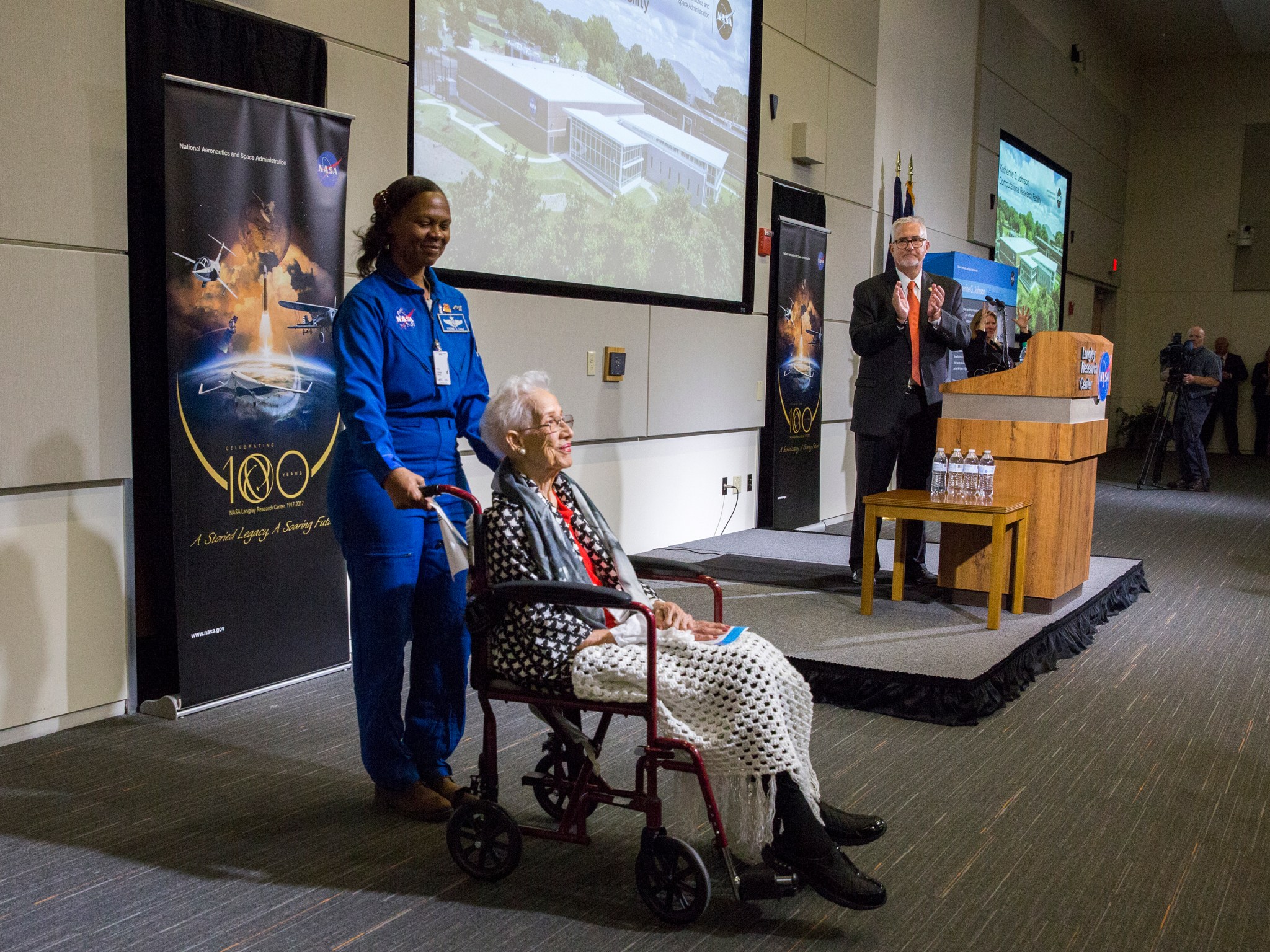 Astronaut Dr. Yvonne Cagle is with Johnson as she receives a standing ovation from the crowd at the ribbon-cutting ceremony.