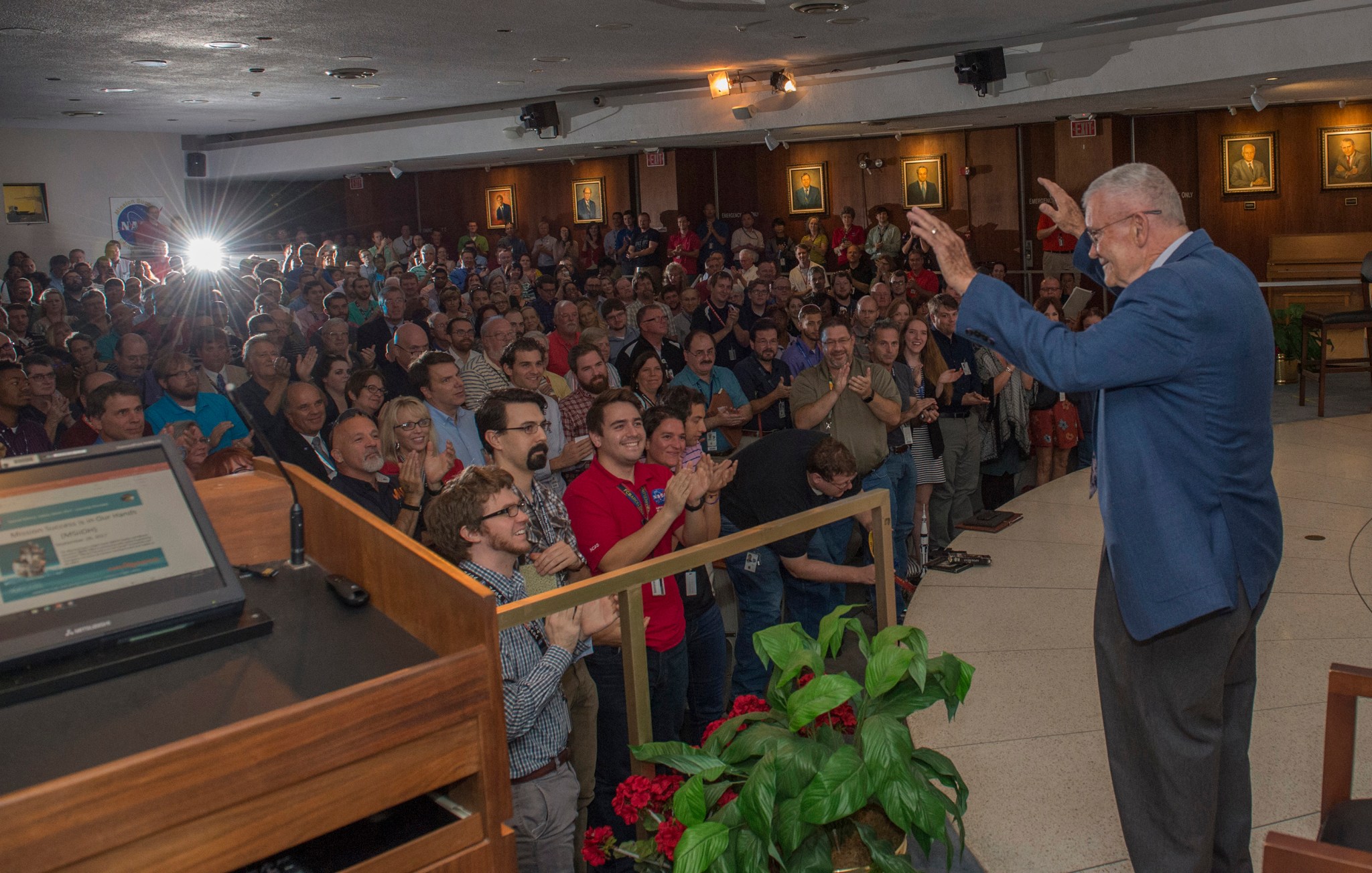 Former NASA astronaut Fred Haise Jr., right, receives a standing ovation from members of the Marshall workforce Sept. 28.