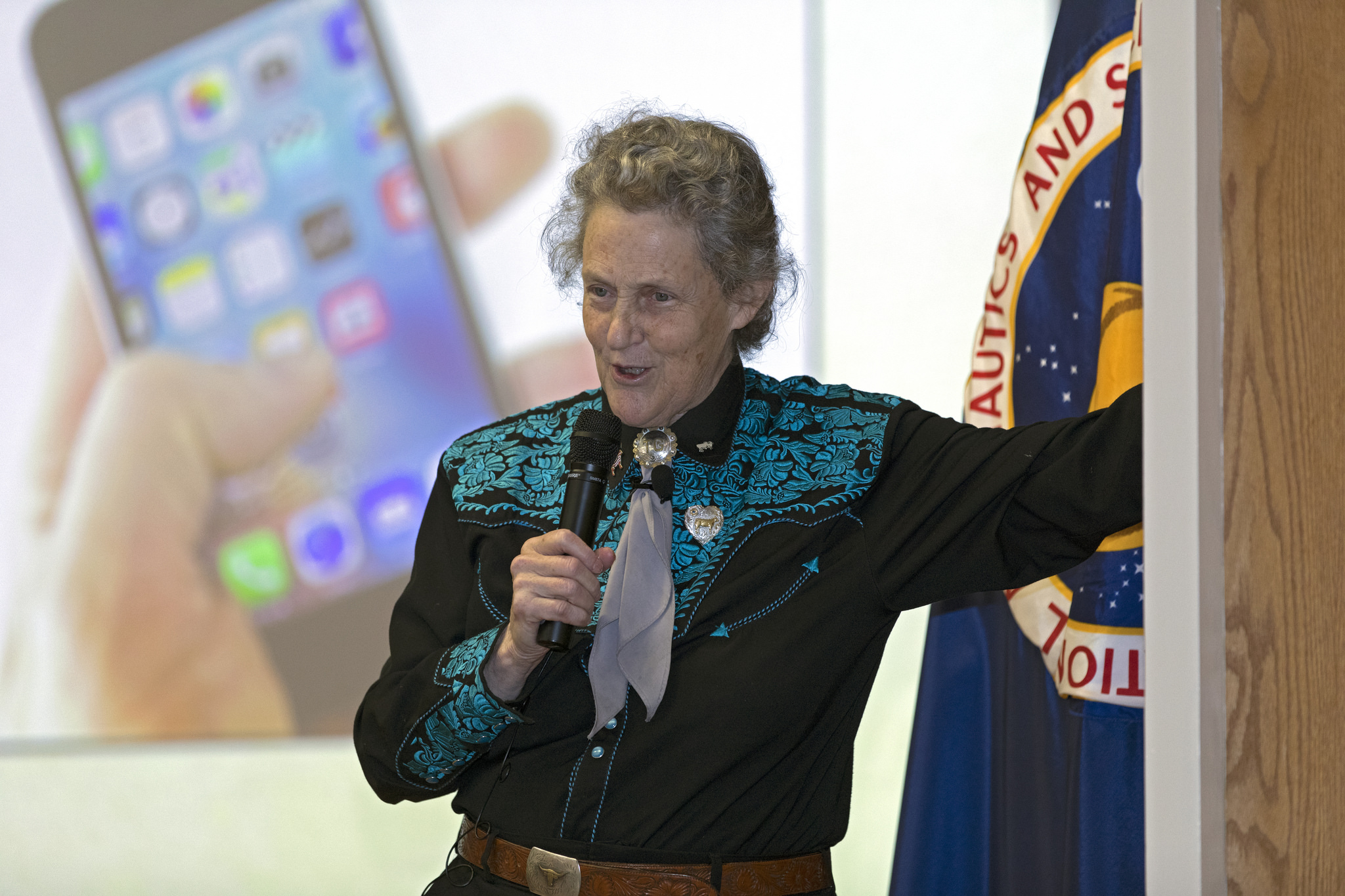 Dr. Temple Grandin addresses employees as the keynote speaker at Kennedy's National Disability Employment Awareness Month event