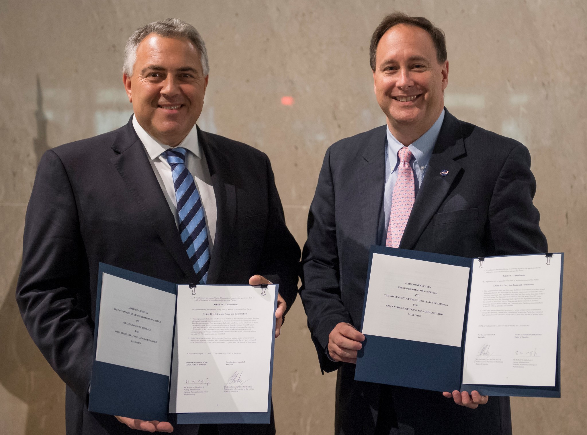 Australian ambassador Joe Hockey & acting NASA Administrator Robert Lightfoot pose for a photograph after signing an agreement 