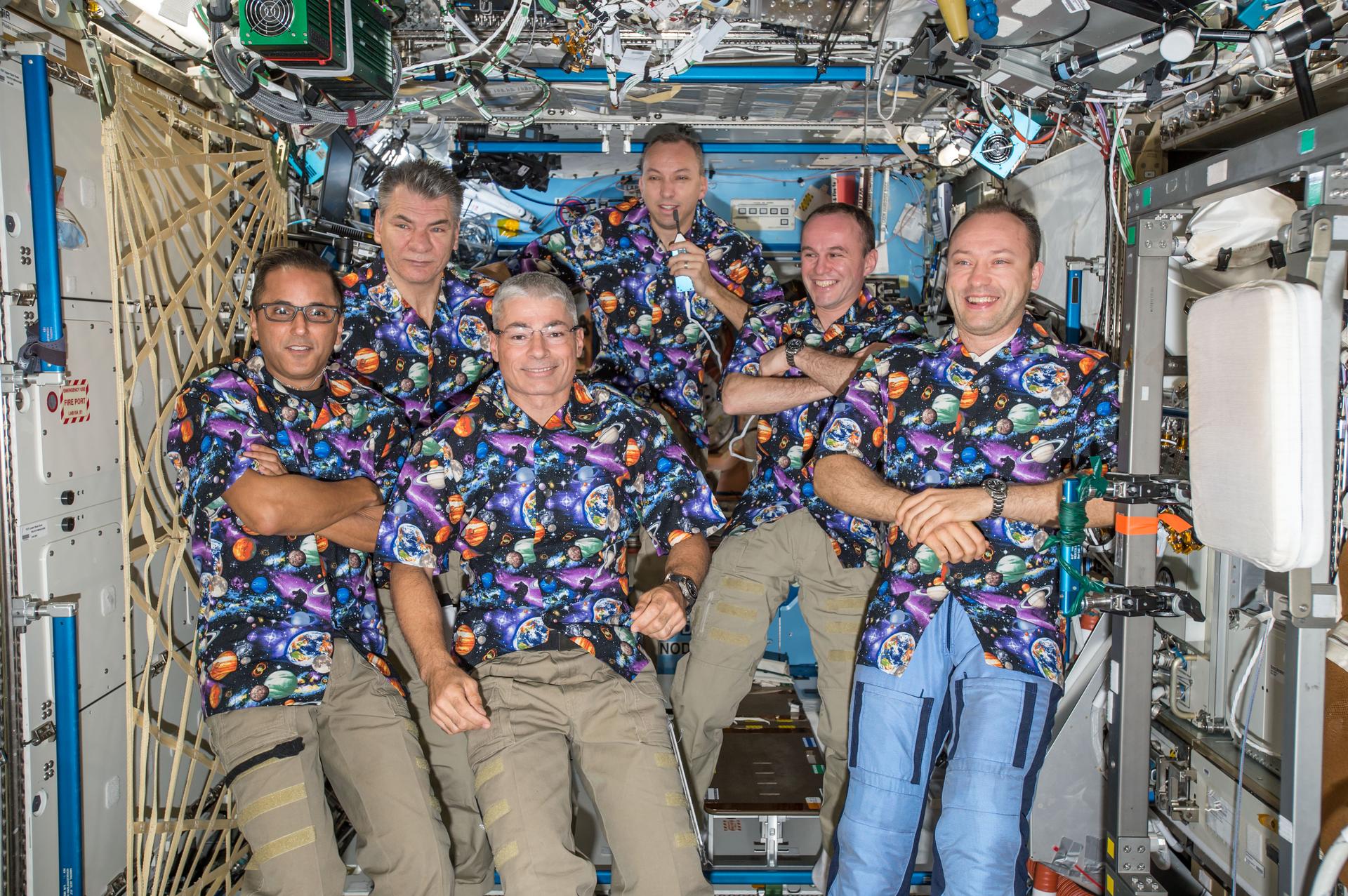 he six Expedition 53 crew members gather together in the Destiny laboratory module for a group portrait.