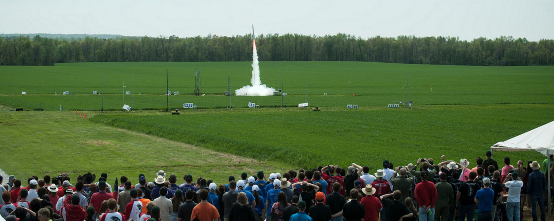 Student-Made Rocket Launches as a Crowd Watches