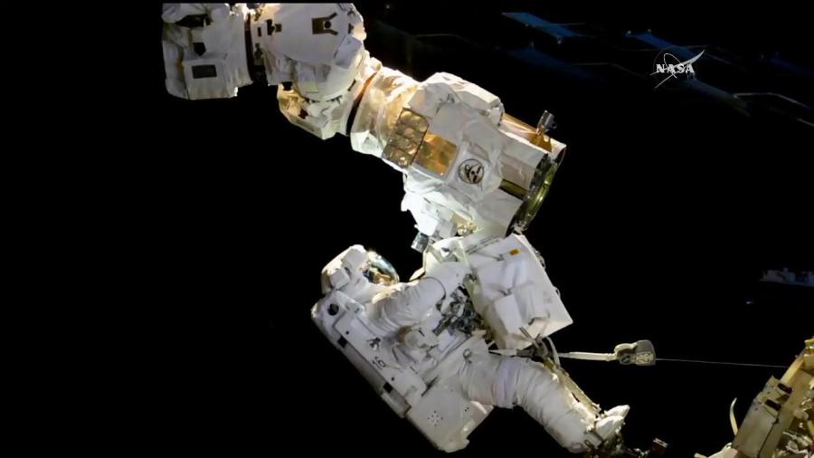 NASA astronauts Randy Bresnik and Joe Acaba install a new camera system to the latching end effector of the Canadaarm2 Oct. 20.