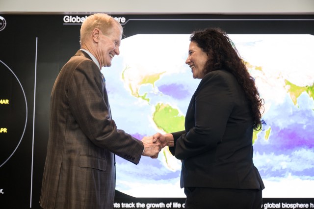 Isabella Casillas Guzman, Administrator of the Small Business Administration (SBA), right, shakes hands with NASA Administrator Bill Nelson
