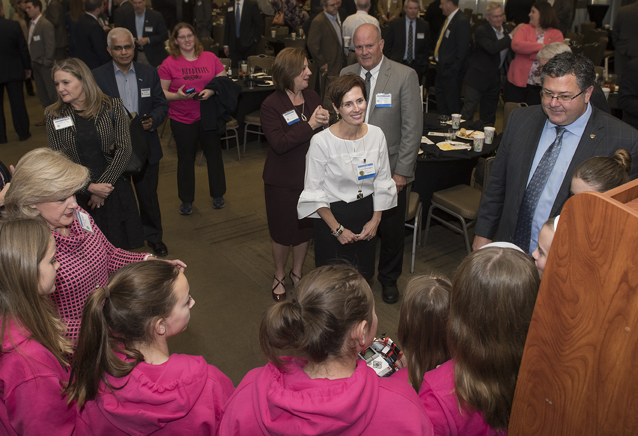Todd May, right, Jody Singer, far left, and Lisa Monaco, center, chat with “the Nerdettes.”