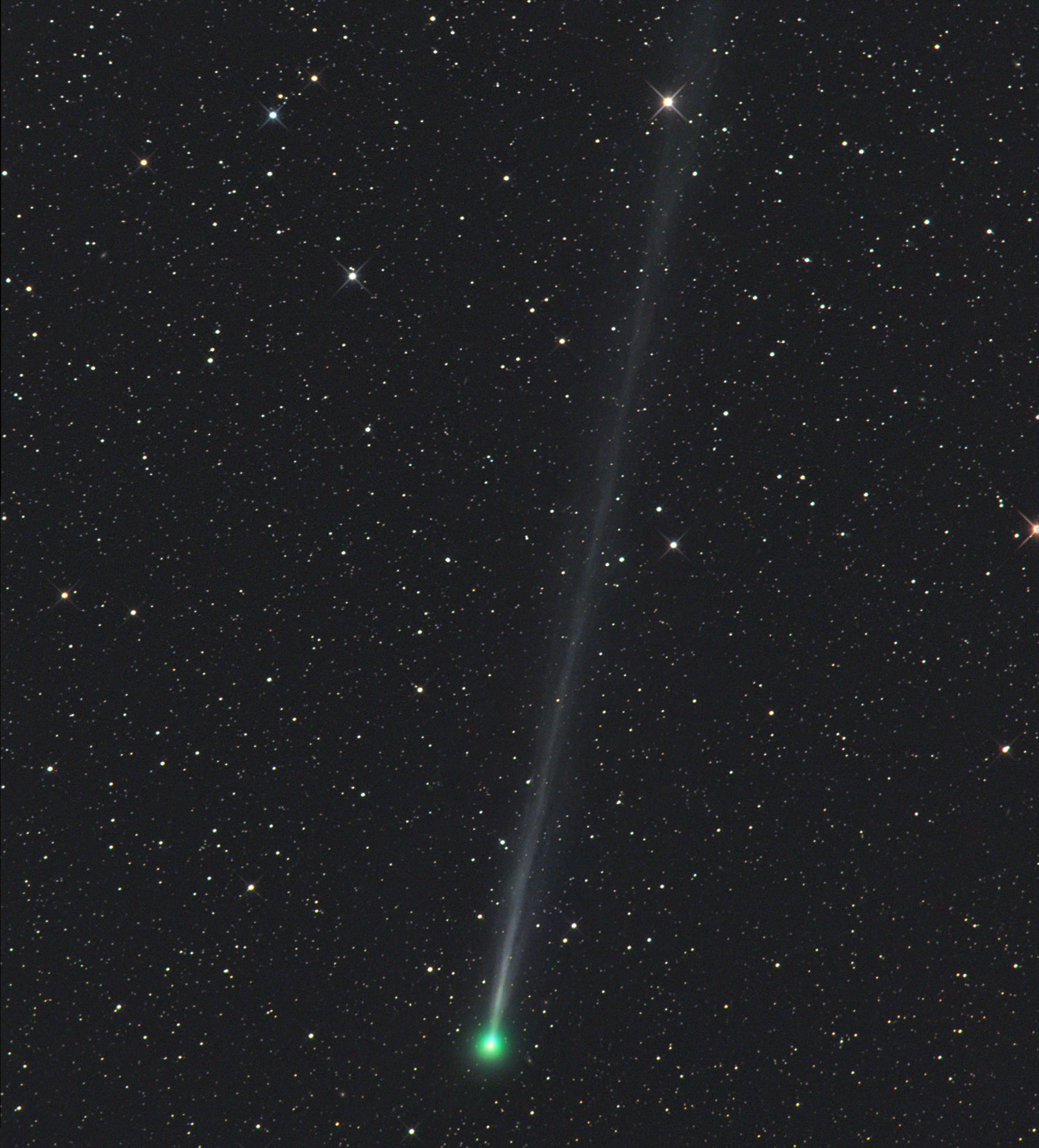 greenish comet against stars