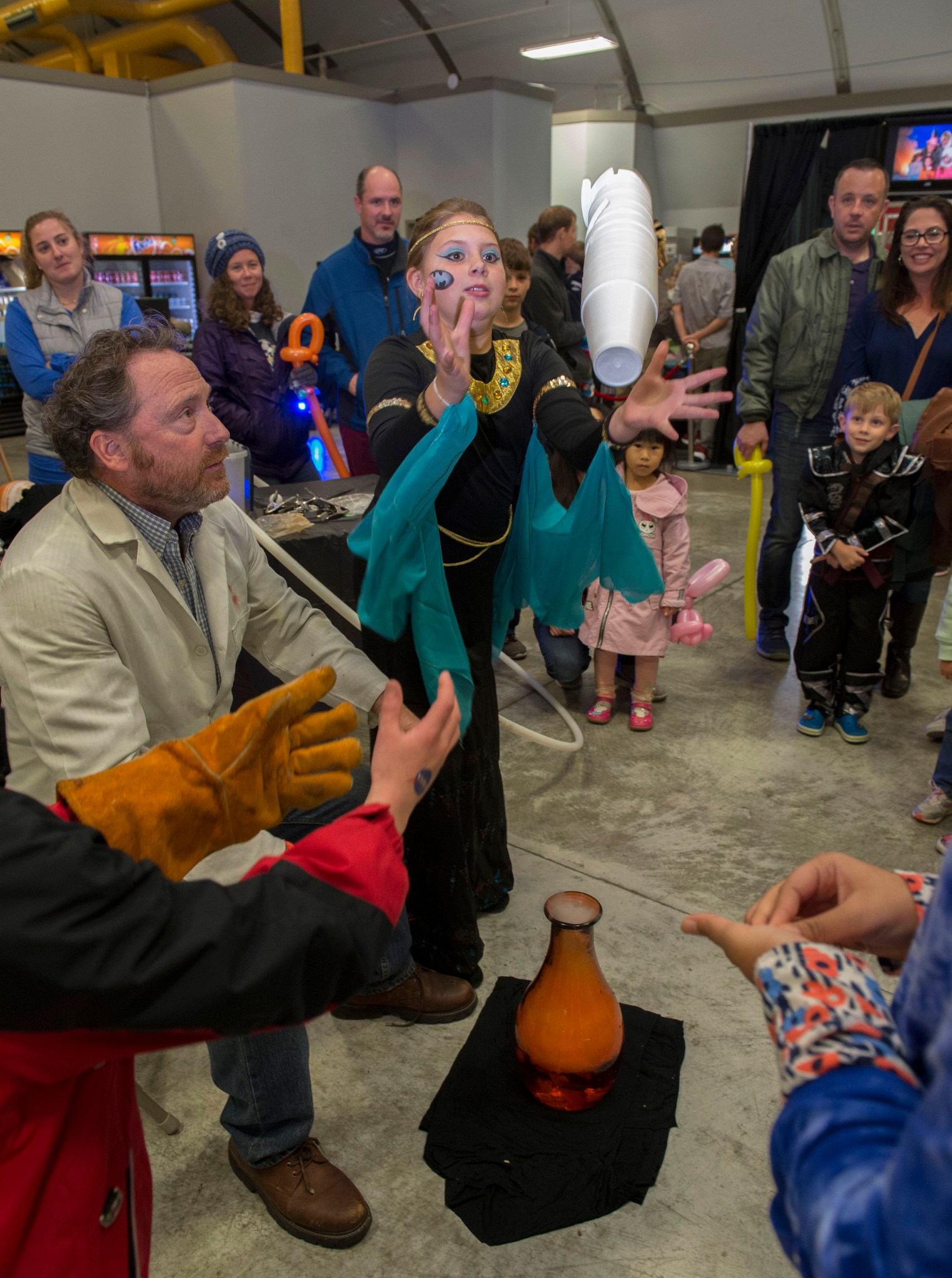 A volunteer assists an eager participant at International Observe the Moon Night Oct. 28 at the U.S. Space & Rocket Center.
