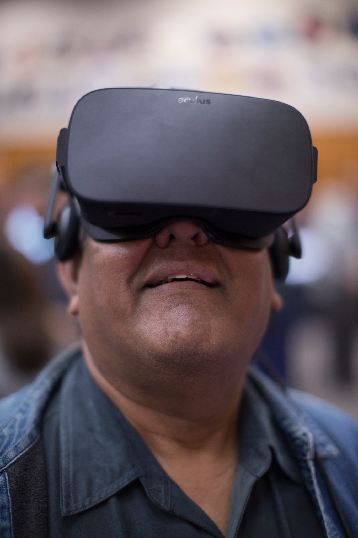 A worker tries out a virtual reality experience during the 2017 Innovation Expo at NASA's Kennedy Space Center. 