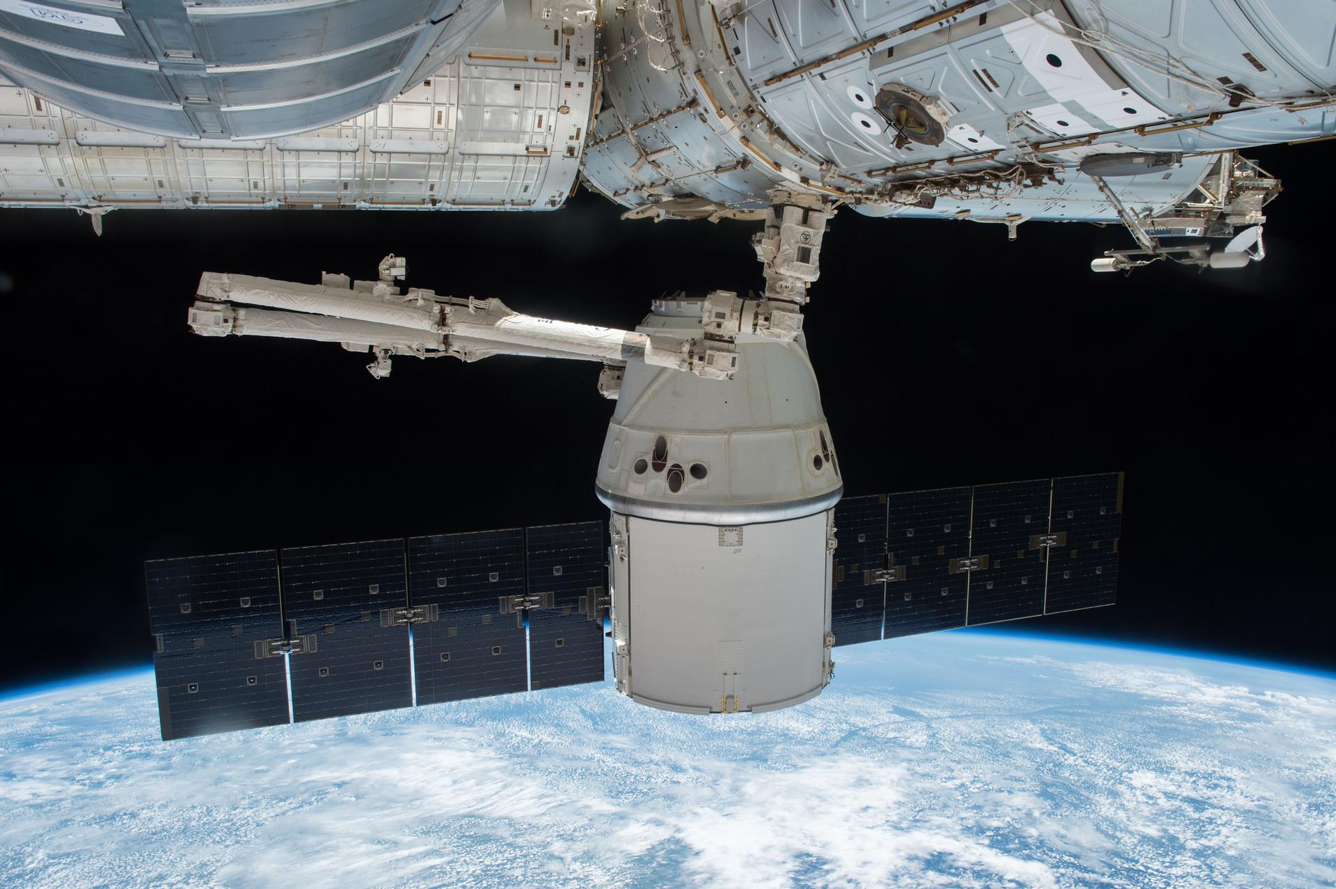 SpaceX Dragon is seen berthed to the Earth-facing side of the International Space Station.