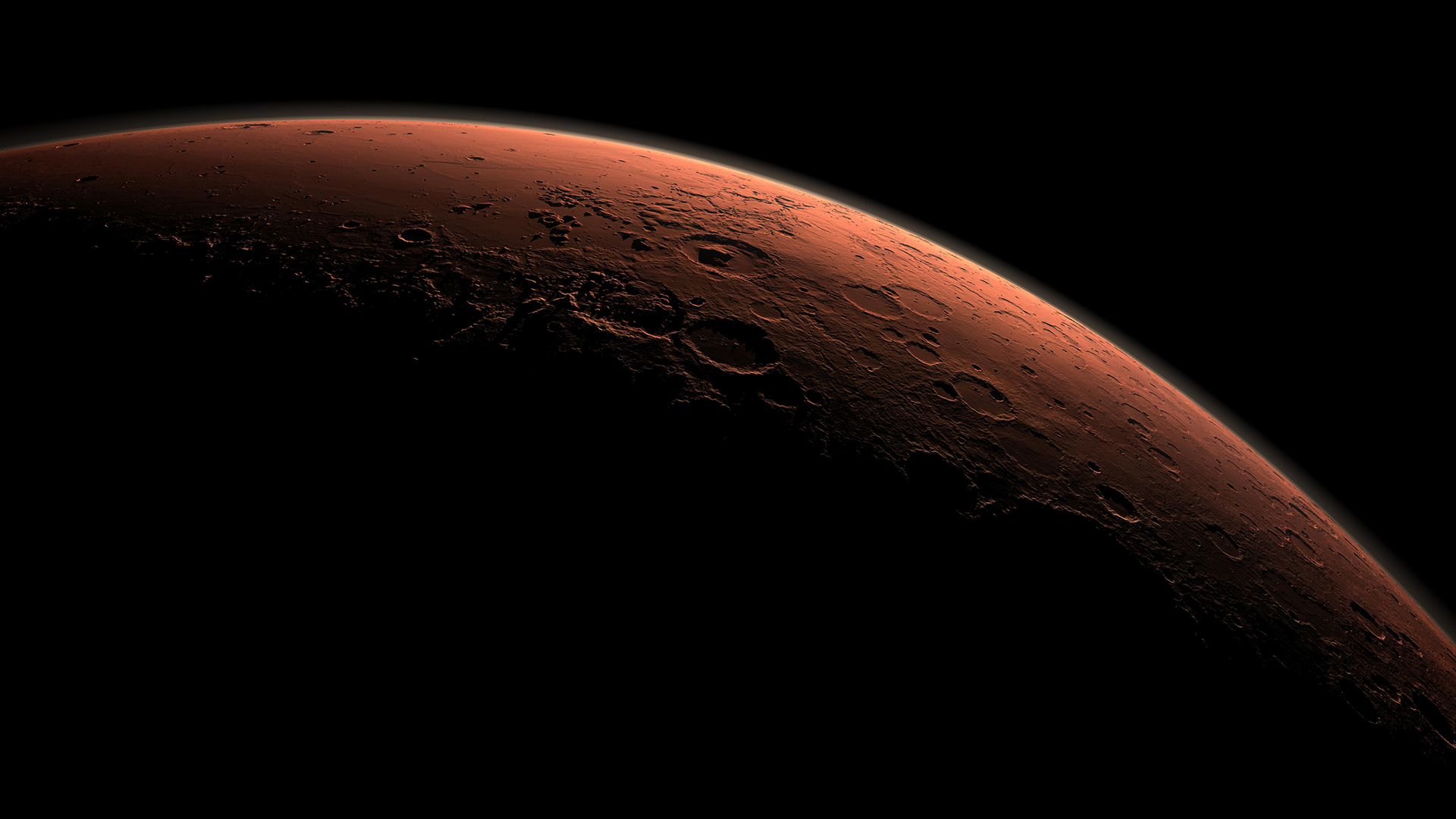 Looking down at Mars from space at sunset