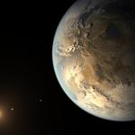 An illustration of Kepler-186f, the first Earth-size planet discovered within a star’s habitable zone. The planet appears large on the right, illuminated by the distant Sun-like star in the lower left of the image. Much of the planet is in shadow, but in the light of its sun, Earthlike continents, oceans and clouds glow gold. Other planets are visible as small, bright spots orbiting the star.