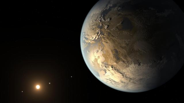 An illustration of Kepler-186f, the first Earth-size planet discovered within a star’s habitable zone. The planet appears large on the right, illuminated by the distant Sun-like star in the lower left of the image. Much of the planet is in shadow, but in the light of its sun, Earthlike continents, oceans and clouds glow gold. Other planets are visible as small, bright spots orbiting the star.