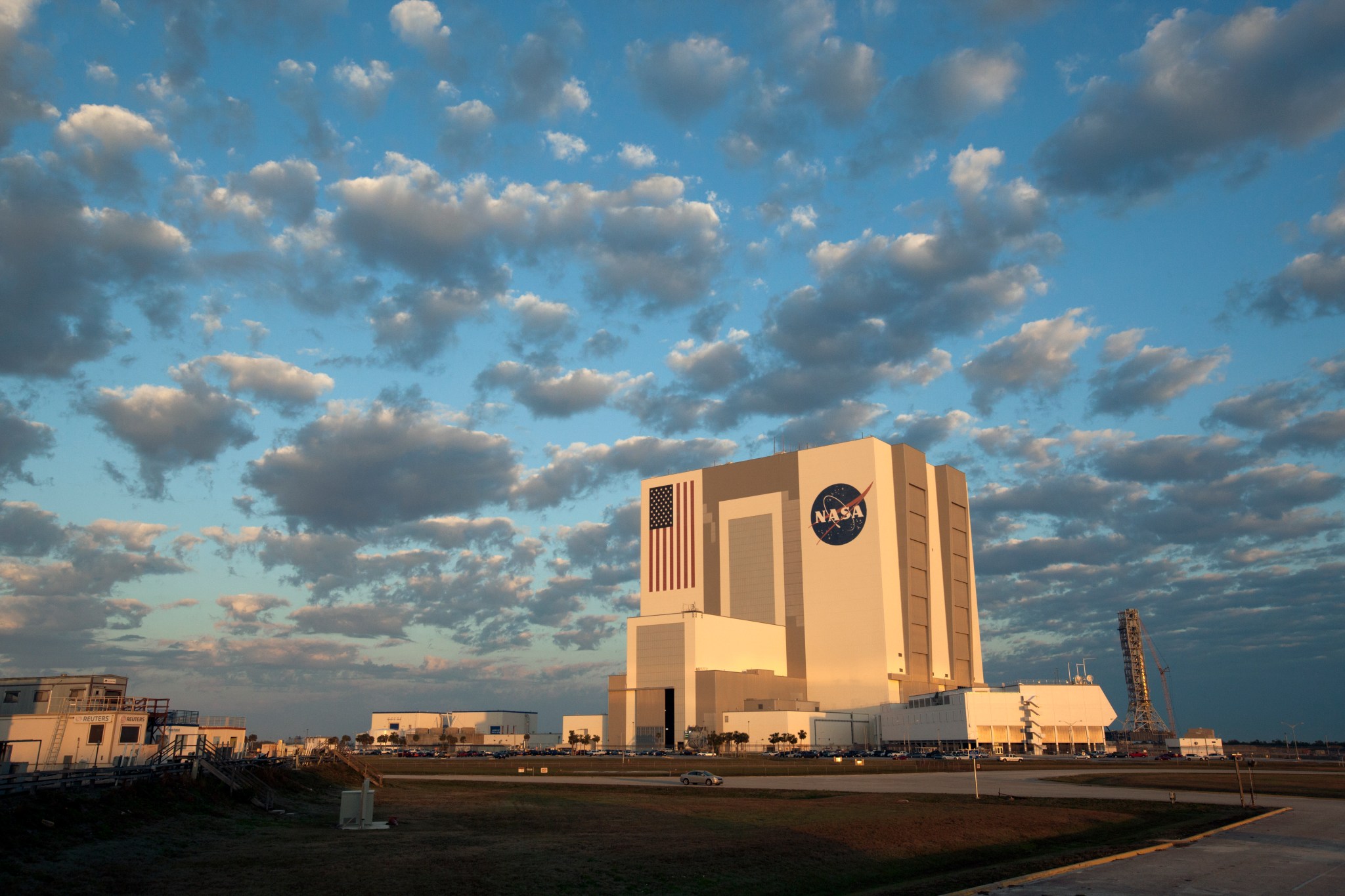 Vehicle Assembly Building at NASA Kennedy photographed in morning with clouds overhead