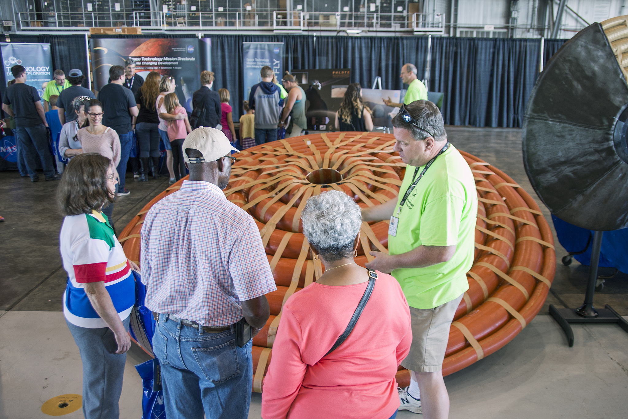 During NASA Langley's Centennial Open House, visitors see a mockup of a Hypersonic Inflatable Aerodynamic Decelerator or HIAD.