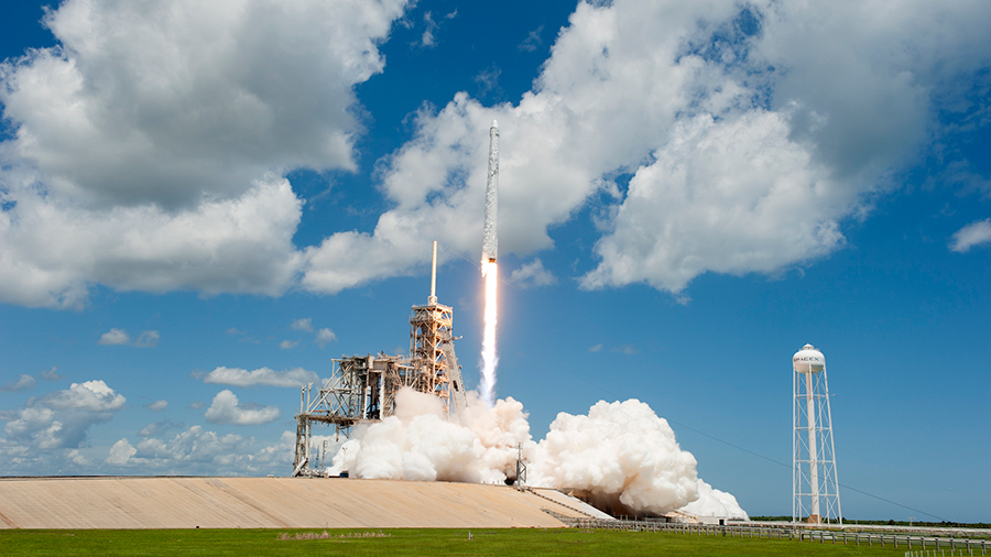 The SpaceX Dragon resupply ship launches atop a Falcon 9 rocket