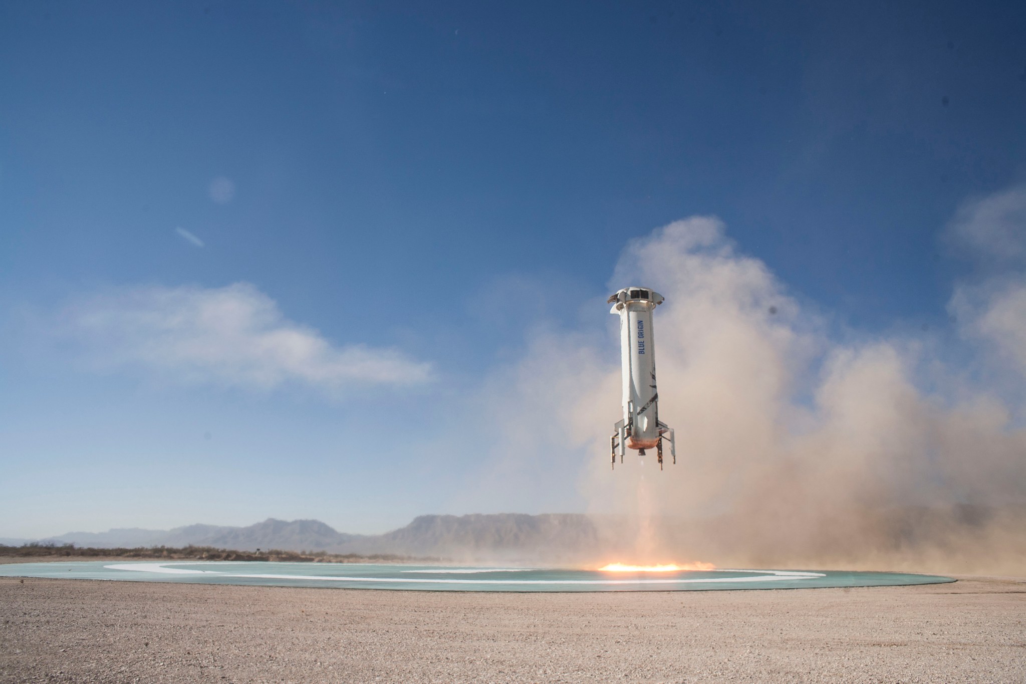 Blue Origin’s New Shepard booster rocket returned to its West Texas launch pad on Dec. 12 after completing a flight.