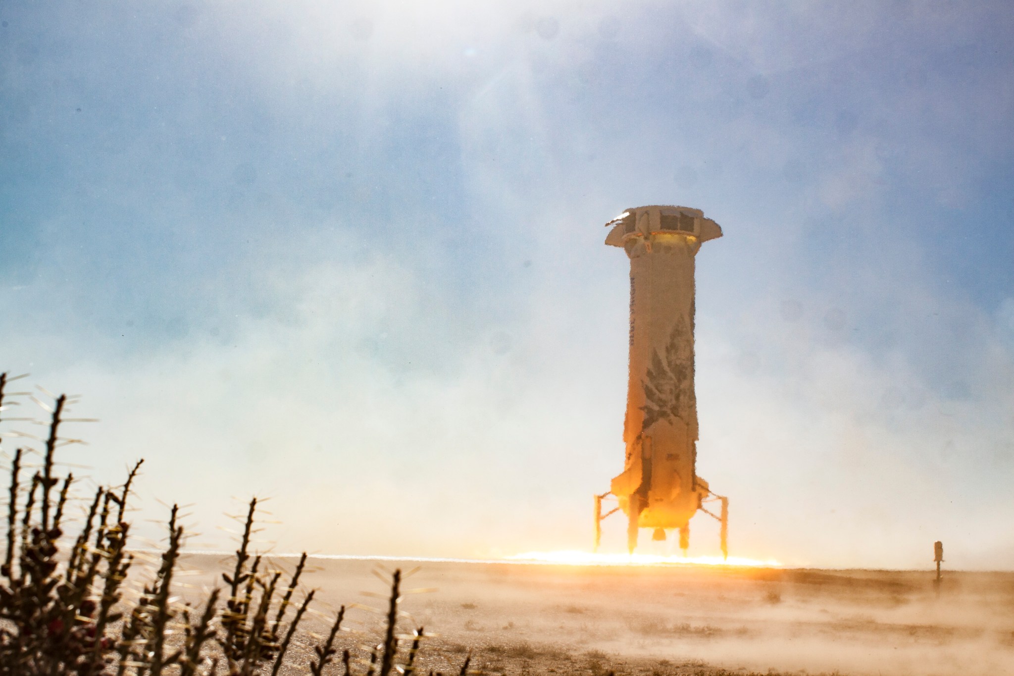 Blue Origin’s New Shepard booster rocket returned to its West Texas launch pad on Dec. 12.