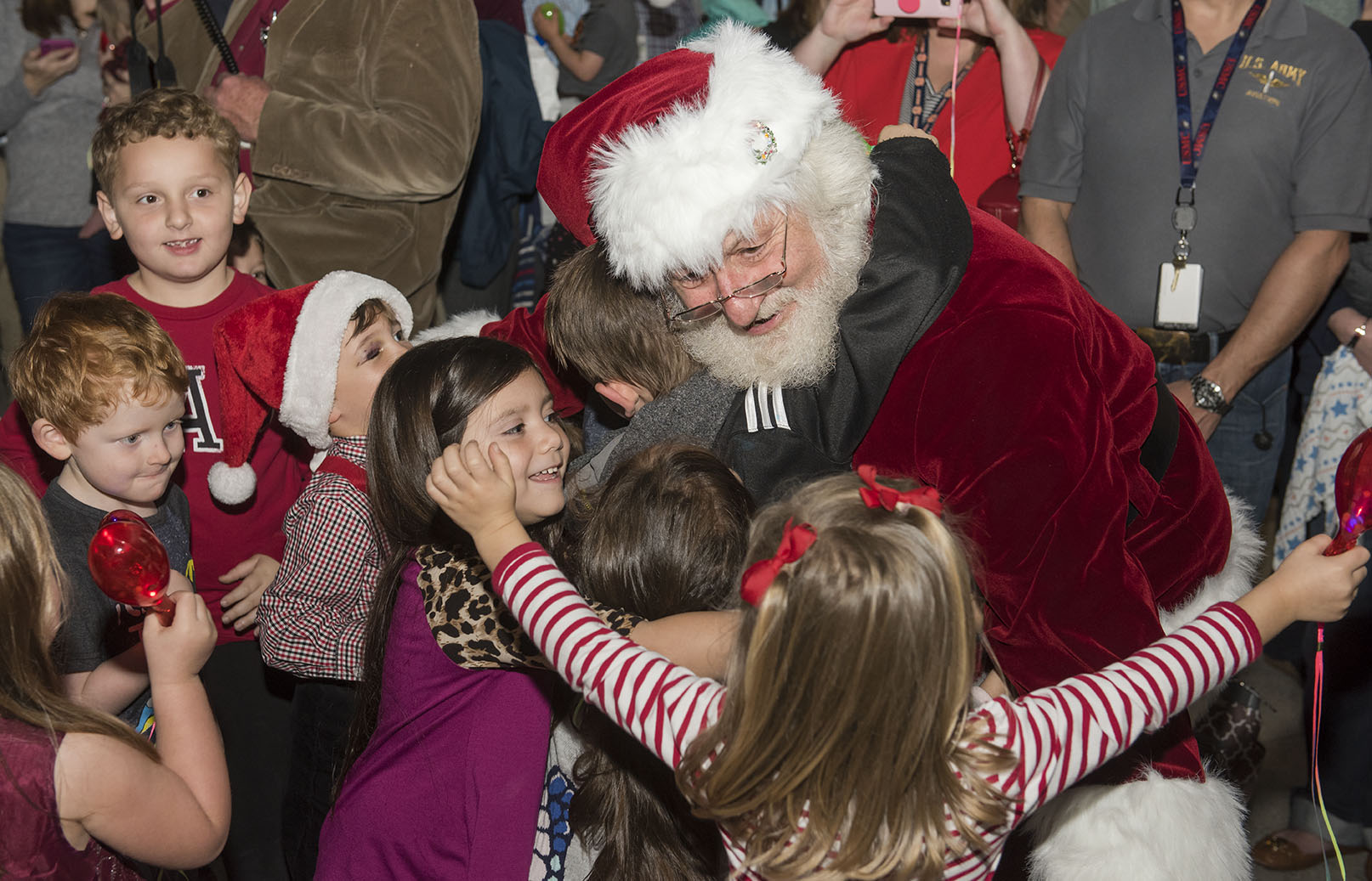 A group of children rush to hug Santa Claus Nov. 30 during NASA Marshall Space Flight Center's holiday tree-lighting ceremony.