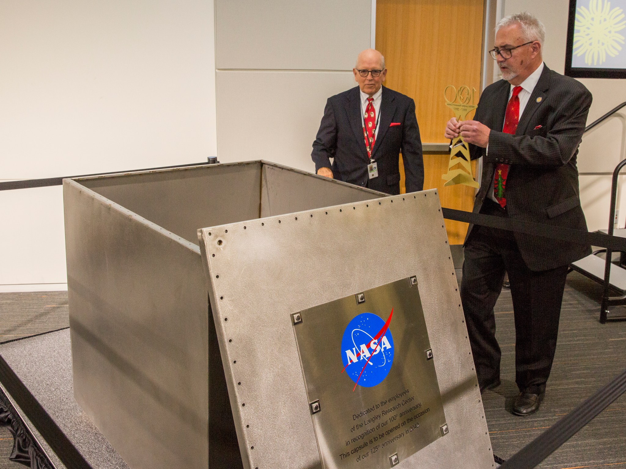 NASA Langley Center Director Dave Bowles is next to the time capsule with former Langley Acting Center Director H. Lee Beach.