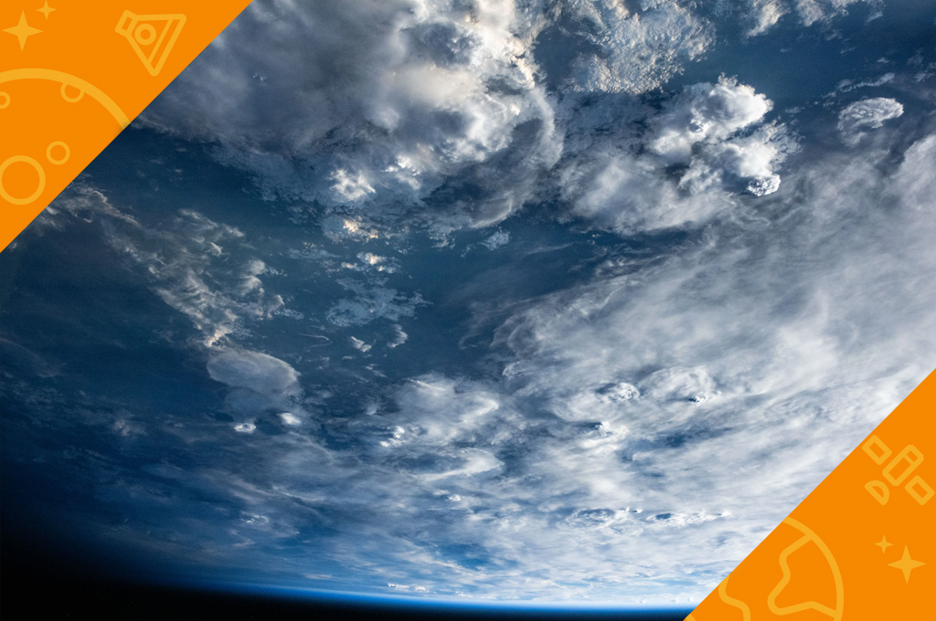Clouds sweep over Southern Africa as the International Space Station begins entering orbital nighttime 261 miles above Earth
