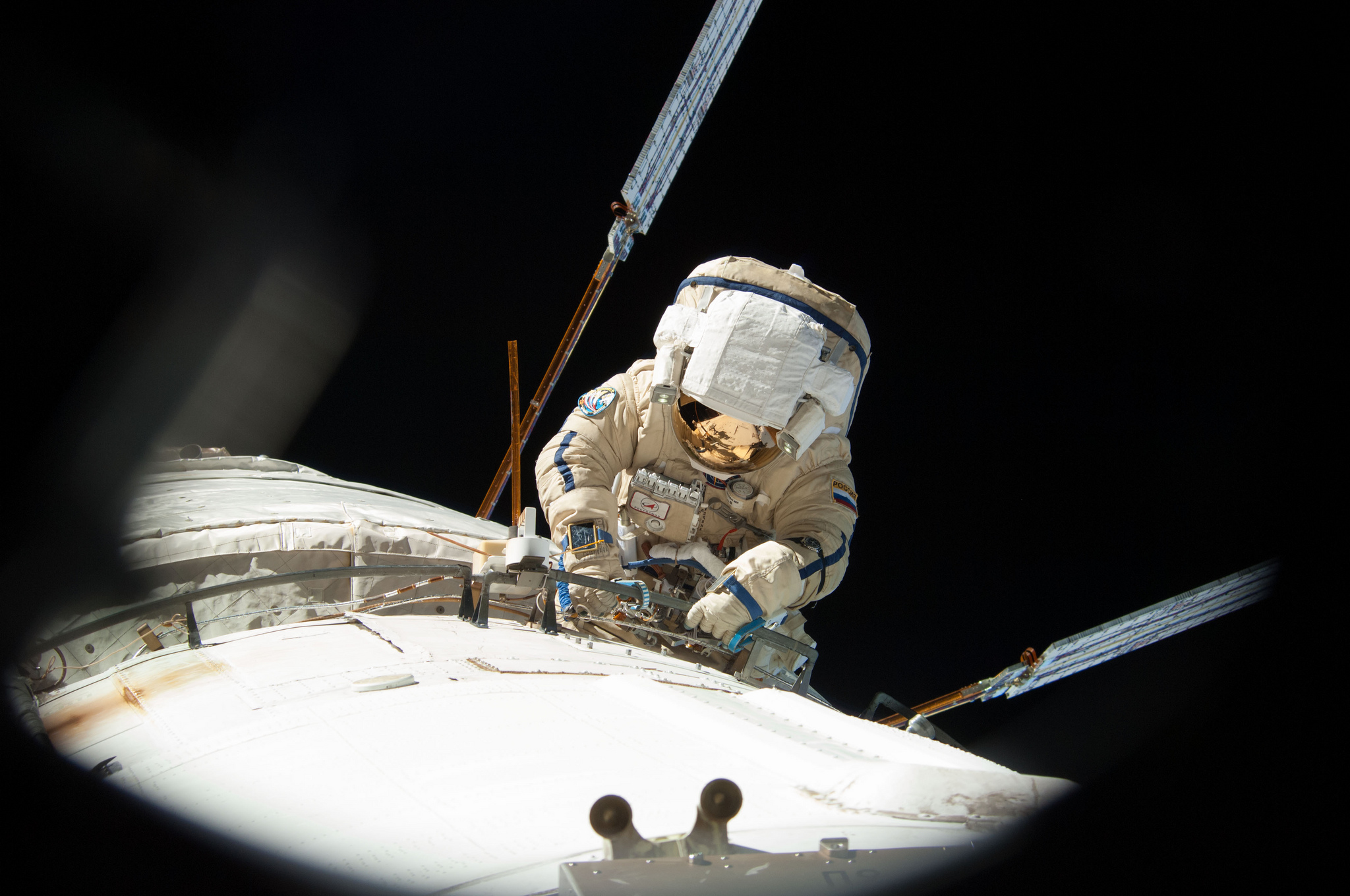 cosmonaut Alexander Misurkin conducts a spacewalk outside the International Space Station