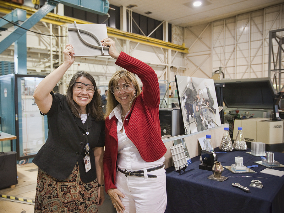 Two women holding up the EBF3 output.