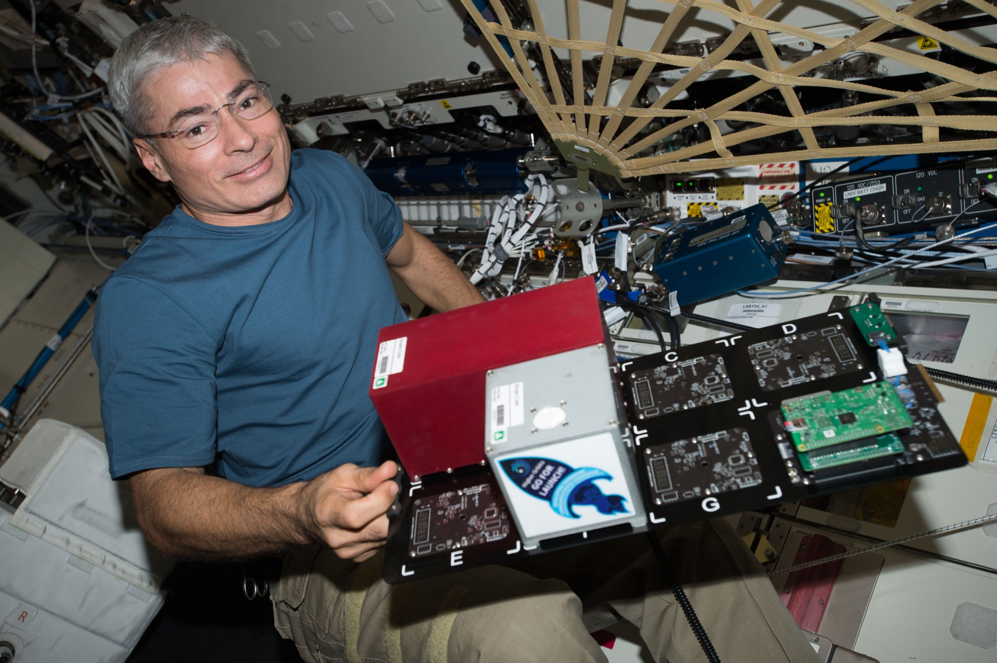 Flight Engineer Mark Vande Hei swaps out a payload card from the TangoLab-1 facility and places into the TangoLab-2 facility