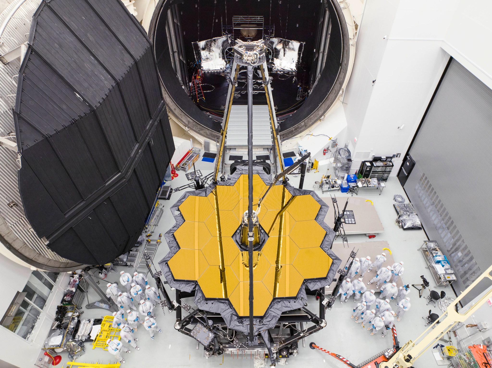 Engineers posed by NASA’s James Webb Space Telescope shortly after it emerged from Chamber A at NASA’s Johnson Space Center.