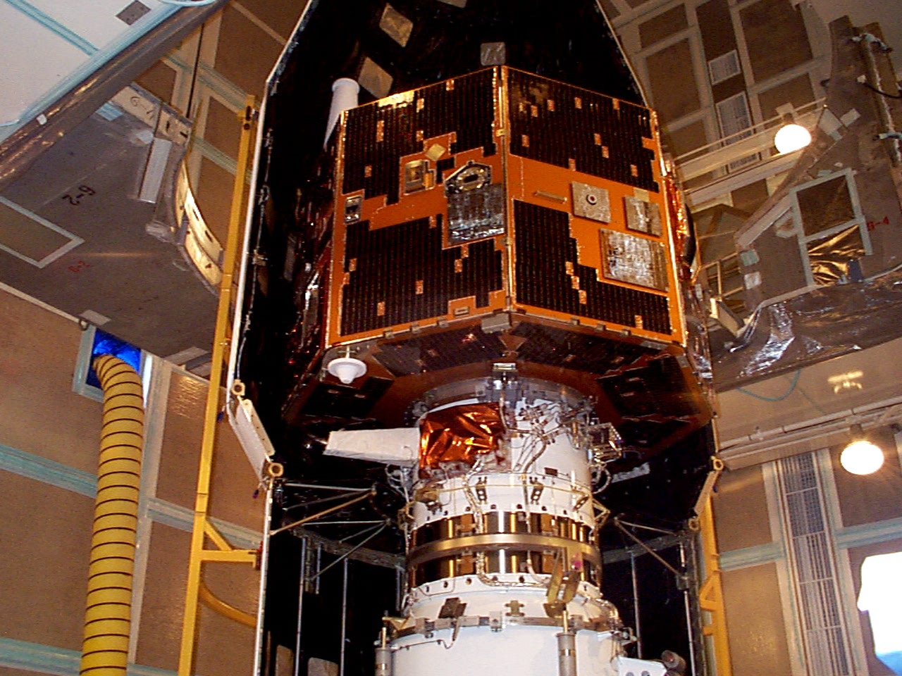 IMAGE spacecraft being enclosed in its fairing prior to launch