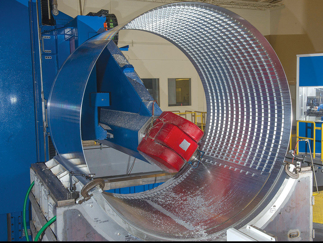 Machining of the 8-foot-diameter orthogrid-stiffened seamless metallic cylinder (no weld lands) structural test article.