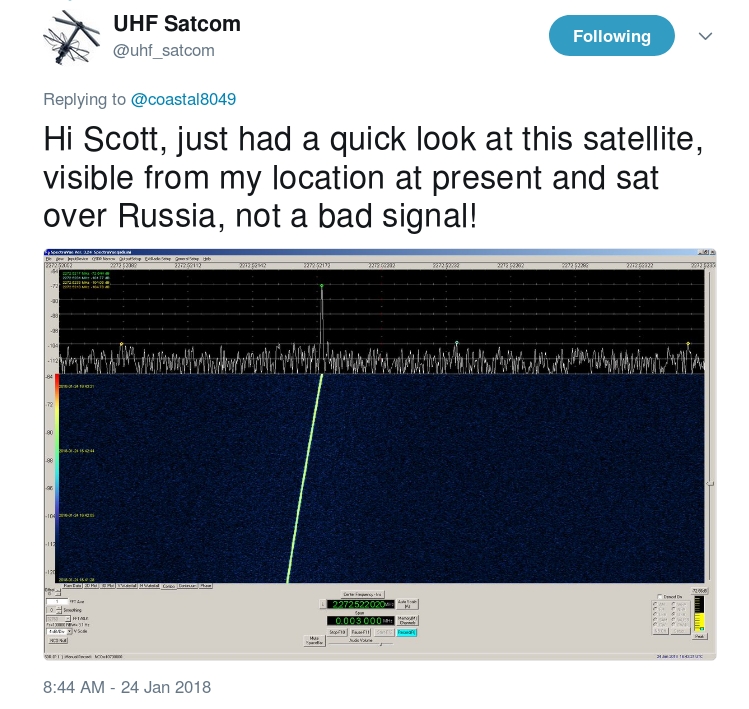 Screenshot of a tweet from UHF Satcom that says "Hi Scott, just had a quick look at this satellite, visible from my location at preset and sat over Russia, not a bad signal!" with an image of a computer readout with a bright line through the center.