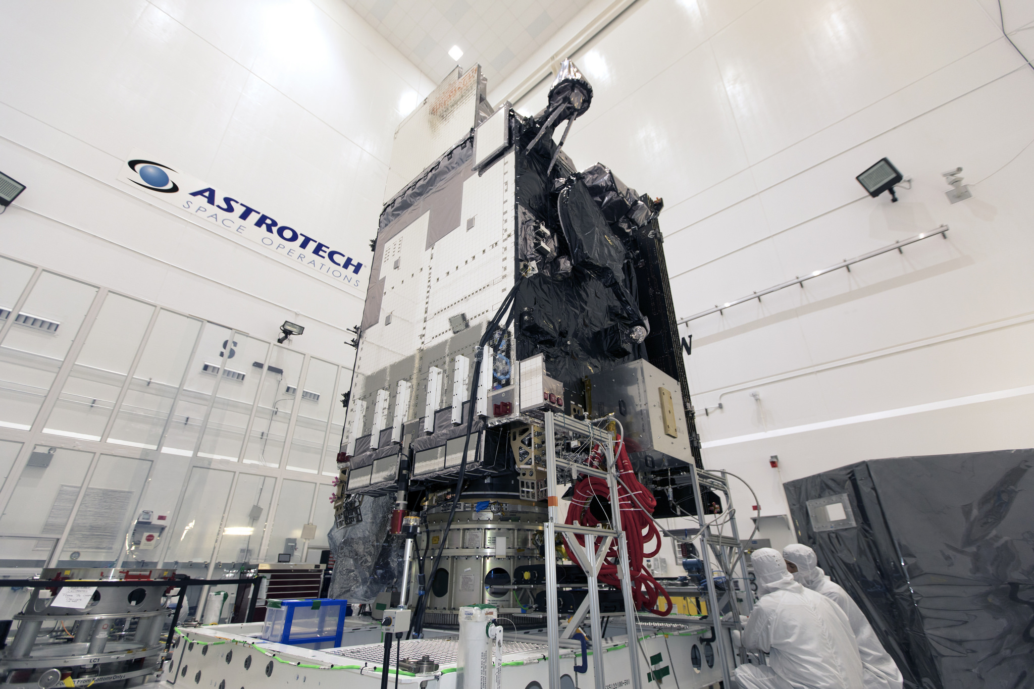 Technicians and engineers prepare NOAA's GOES-S for encapsulation in its payload fairing.