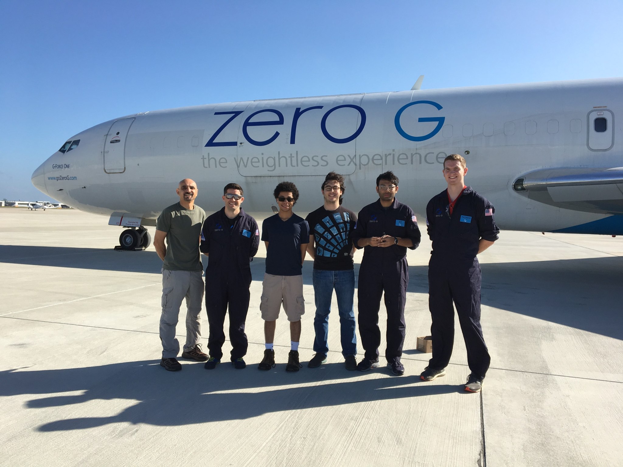 six researchers standing in front of a Zero-G aircraft