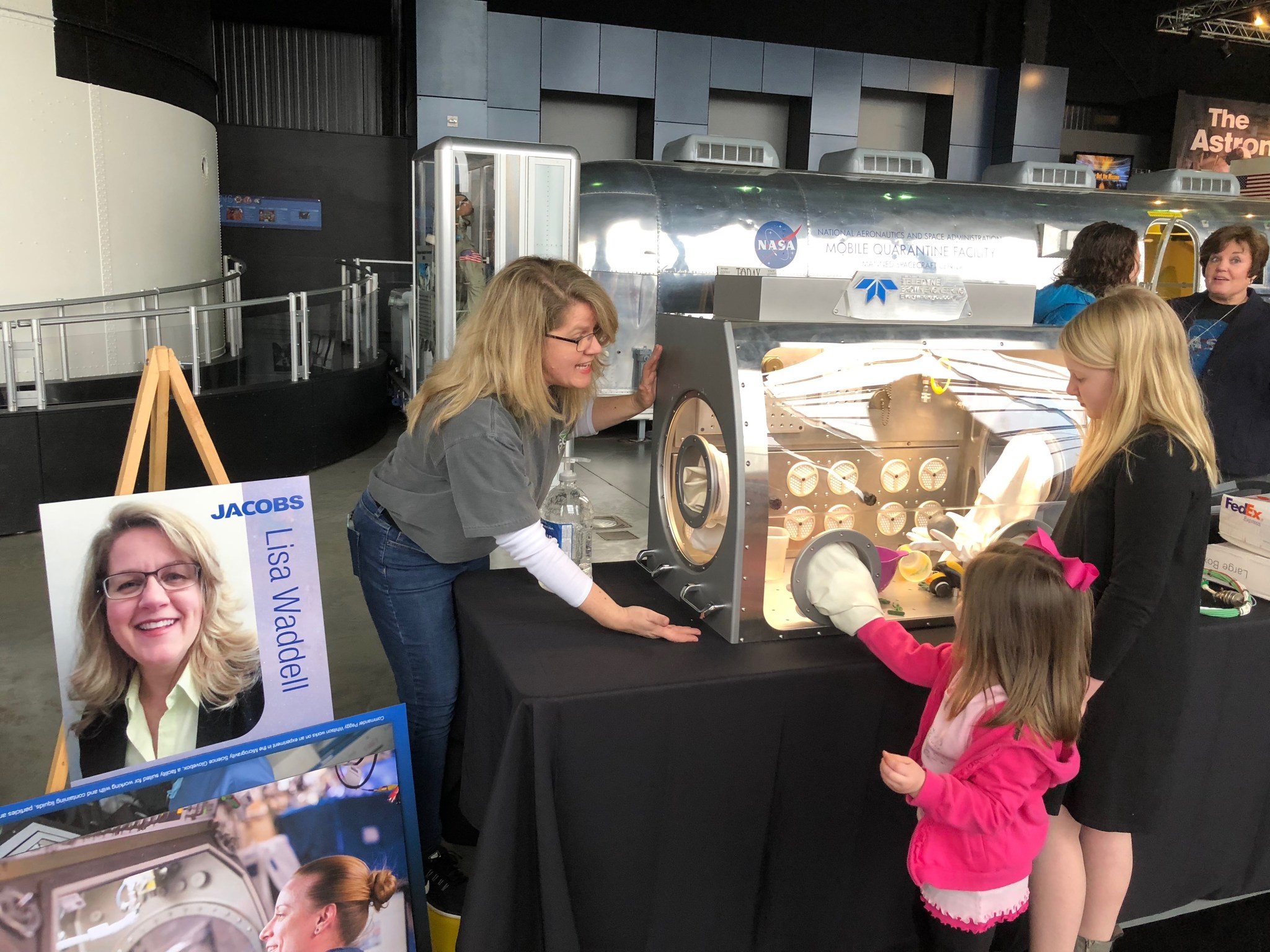 Lisa Waddell teaches young girls about the Life Sciences Glovebox at the Celebration of STEM event at the U.S.S.R.C. on Feb. 4.