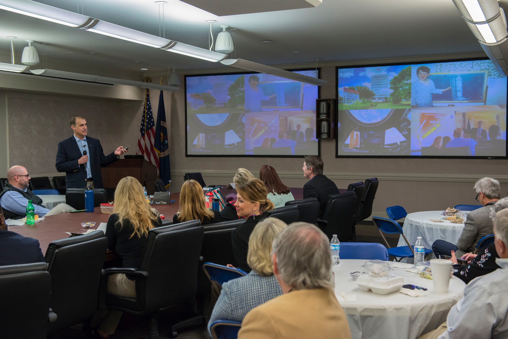 Marshall Associate Director Jonathan Pettus, standing at left, at the Marshall Association’s first luncheon of 2018. 