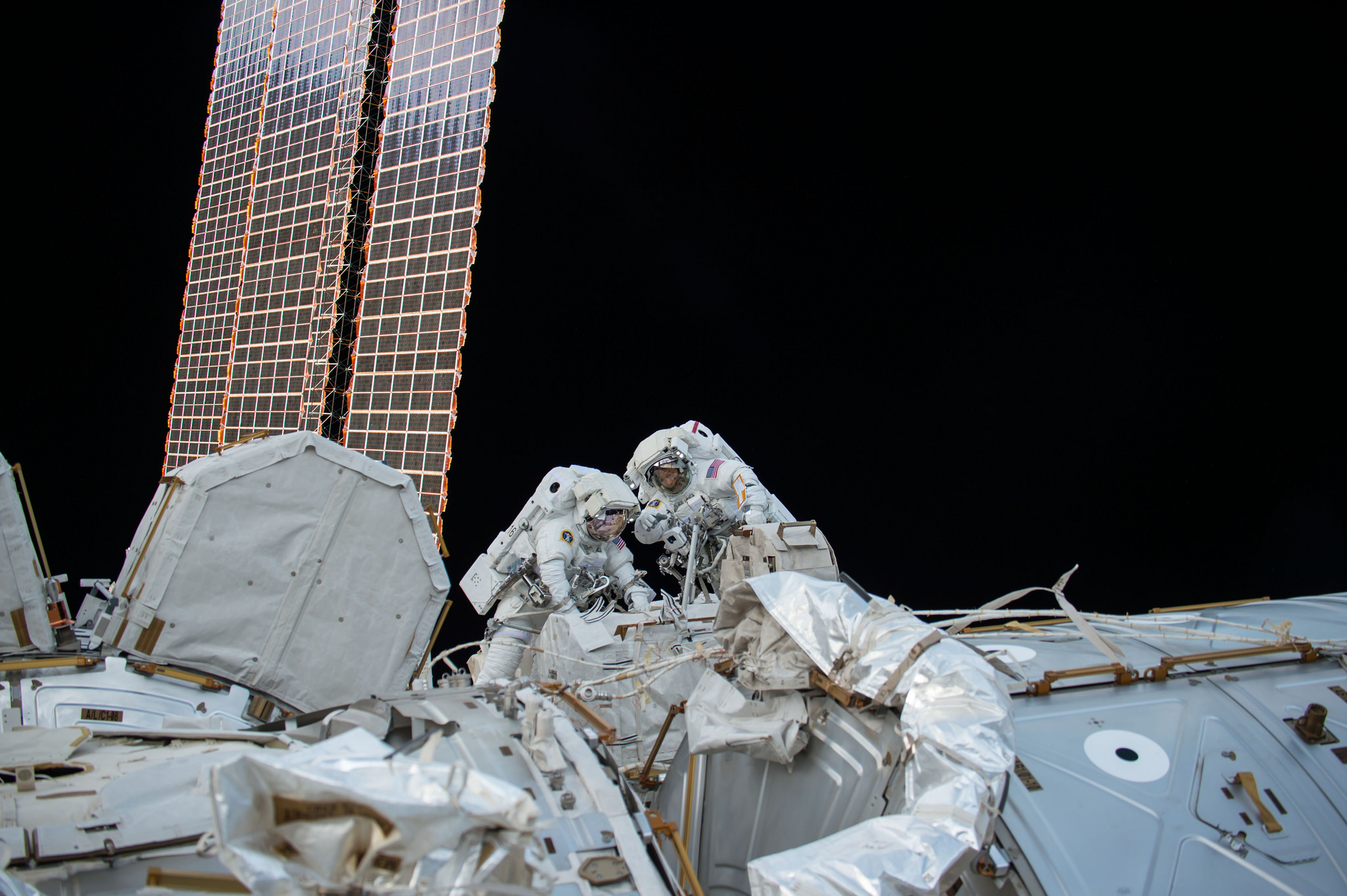 NASA astonauts Mark Vande Hei and Randy Bresnik work outside the International Space Station on Oct. 5, 2017.