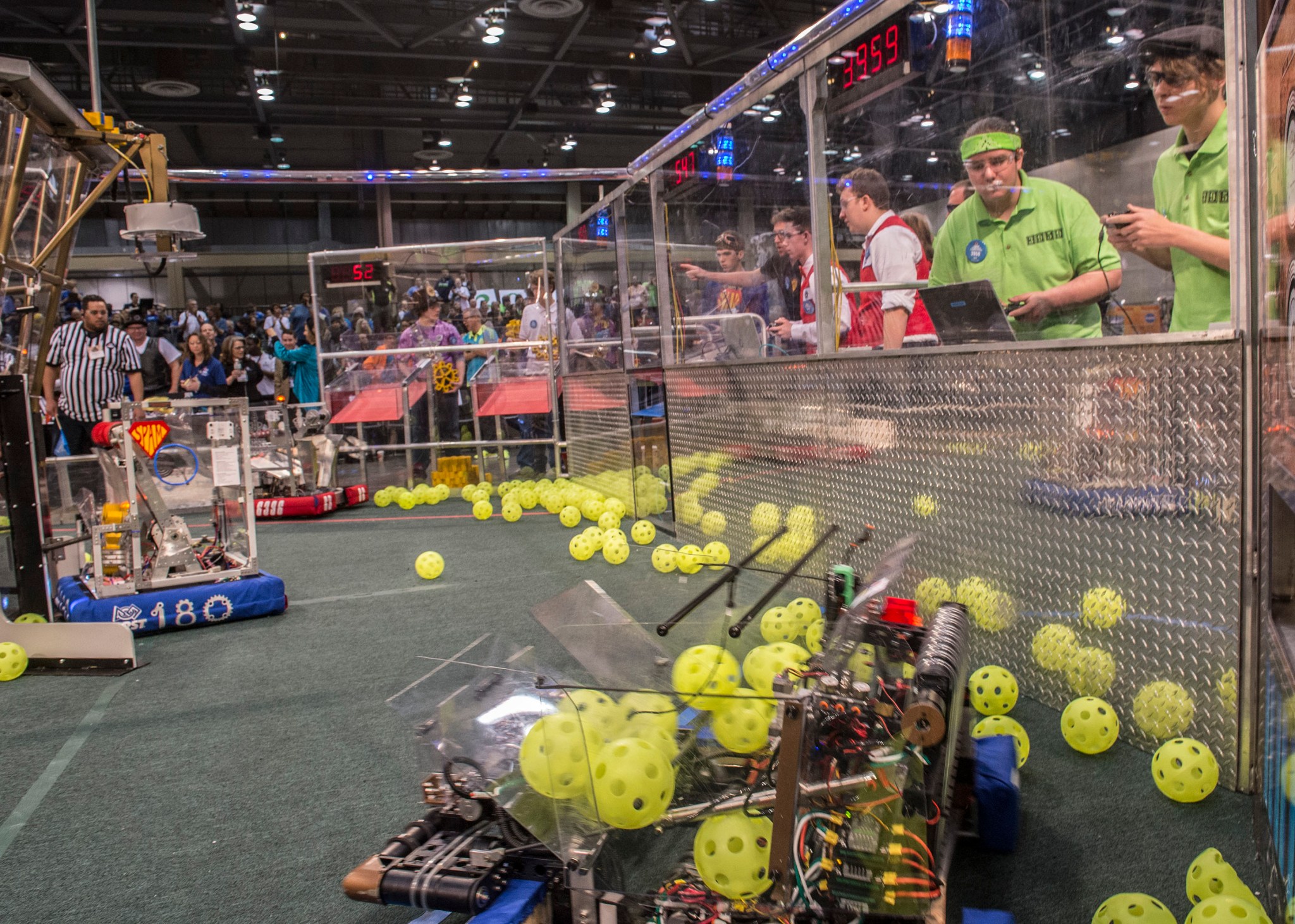 Morgan County, Alabama, Mech Tech team members, at right in green shirts, during the 2017 FIRST Robotics Competition.